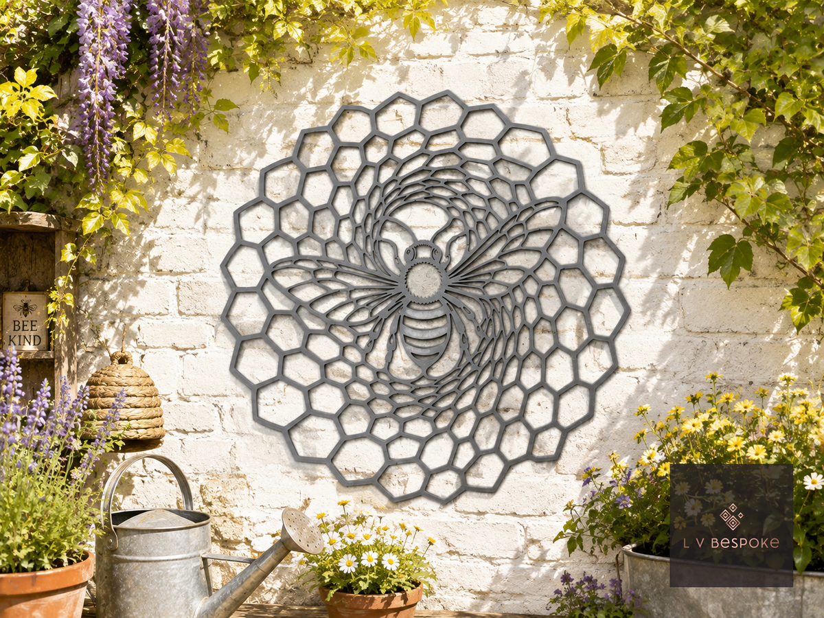 Raw steel Bee & Honeycomb wall art hung on a garden wall