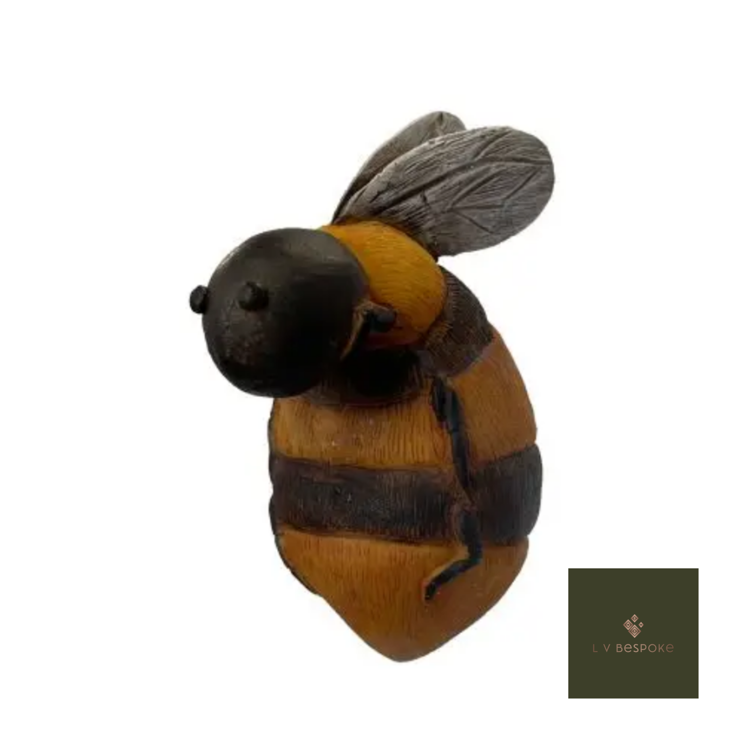 Toy bee with black and yellow stripes on a white background