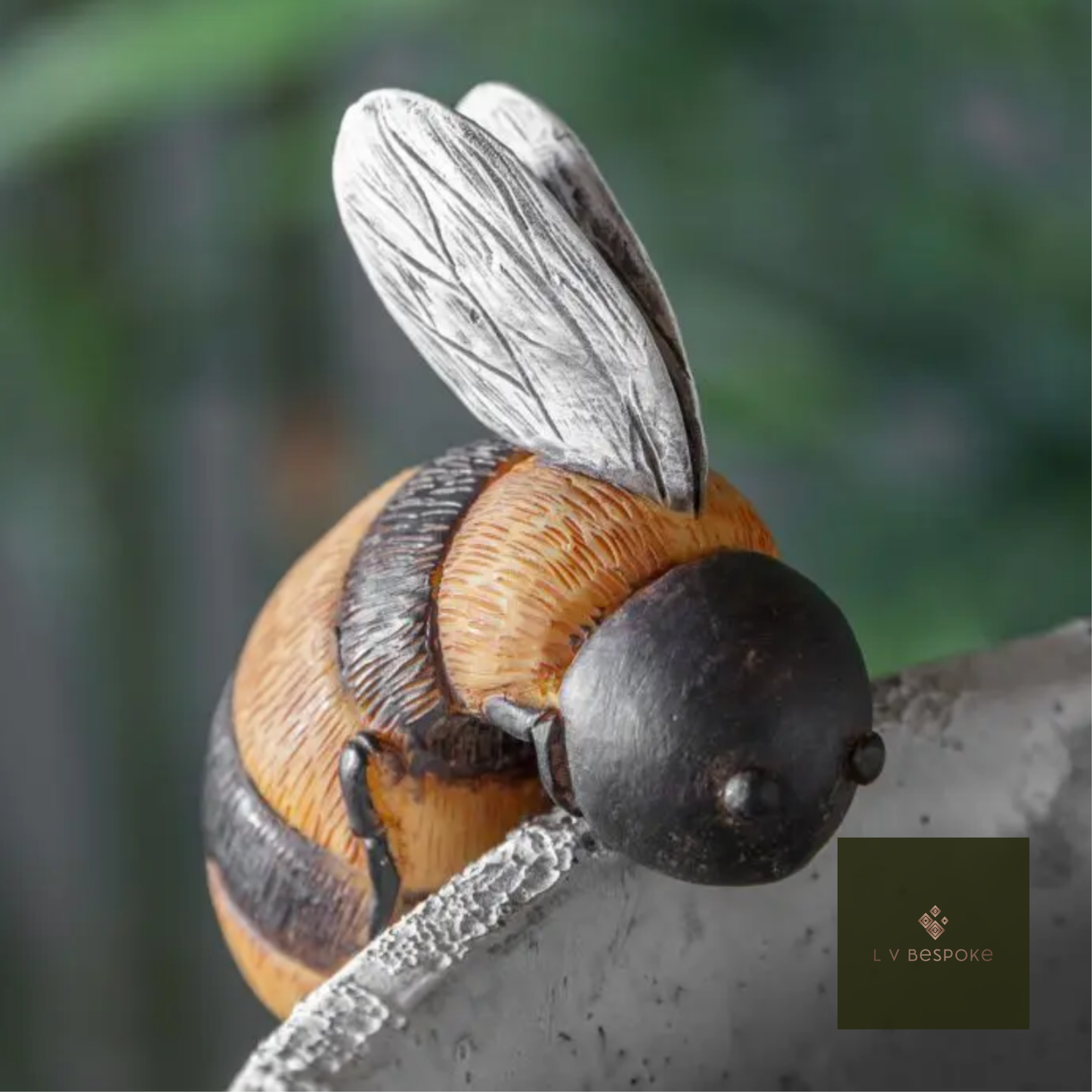 Close-up of a bee sculpture on a blurred natural background