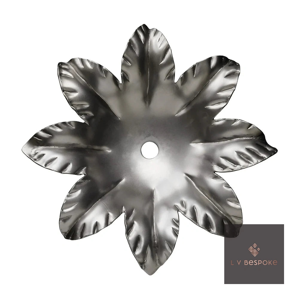 Raw steel flower design on a garden stake