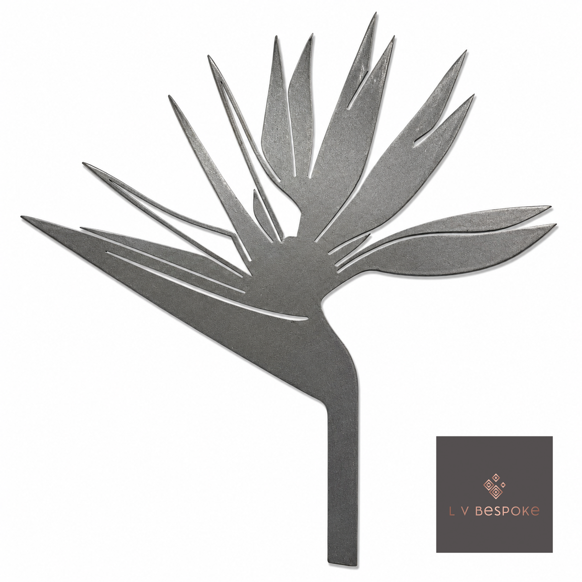 Raw steel Bird of Paradise flower head on a garden stake, planted in a border