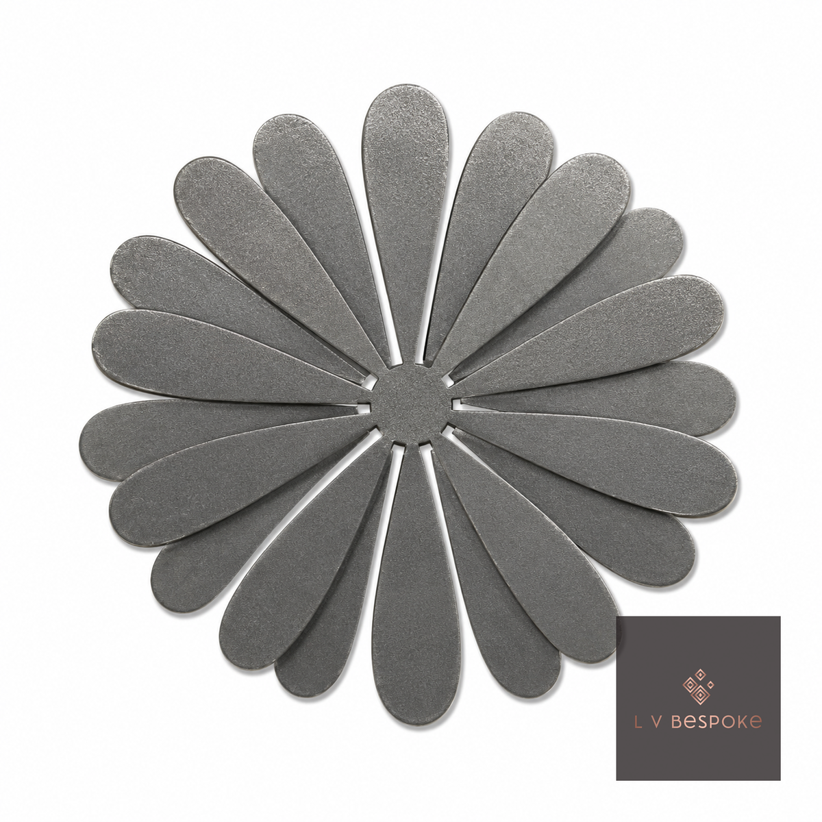 Raw steel Daisy flower head on a garden stake, planted in a border