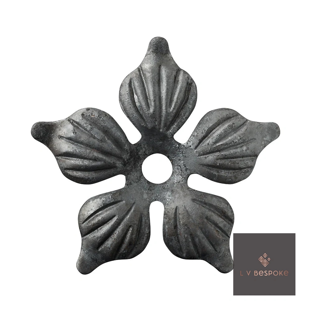 Raw steel Flower 1 flower head on a garden stake, planted in a border