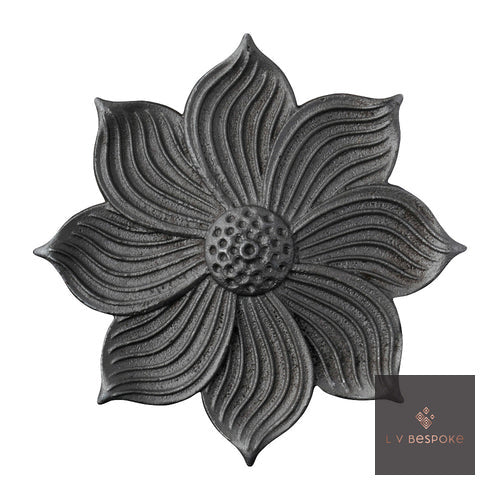 Raw steel Sunflower 1 flower head on a garden stake, planted in a border