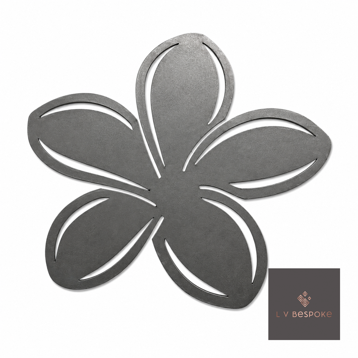 Raw steel Plumeria flower head on a garden stake, planted in a border