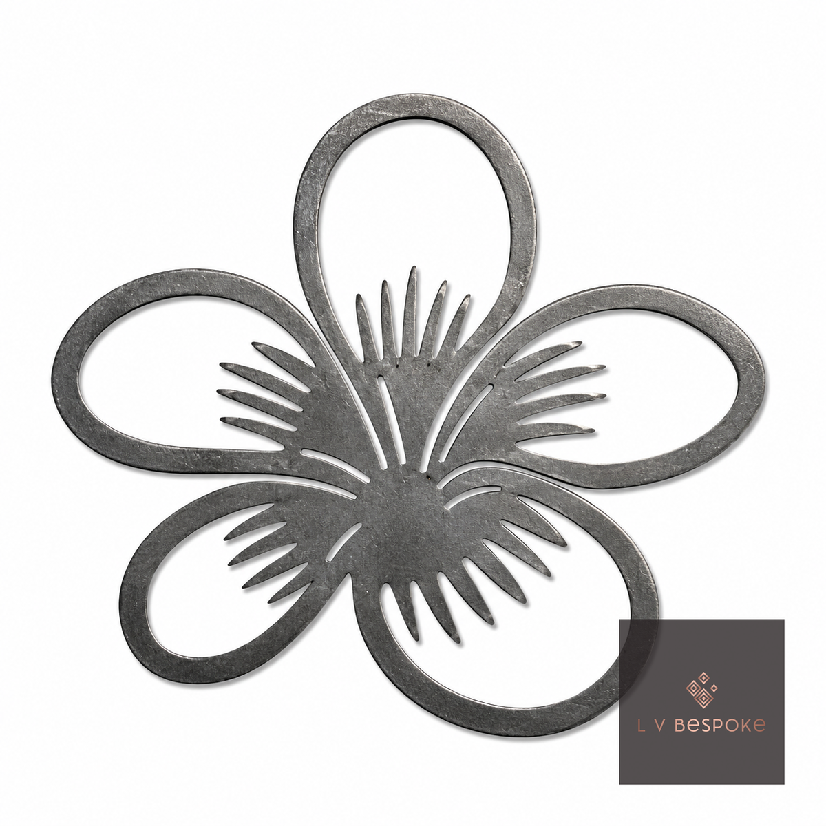 Raw steel Pansy flower head on a garden stake, planted in a border