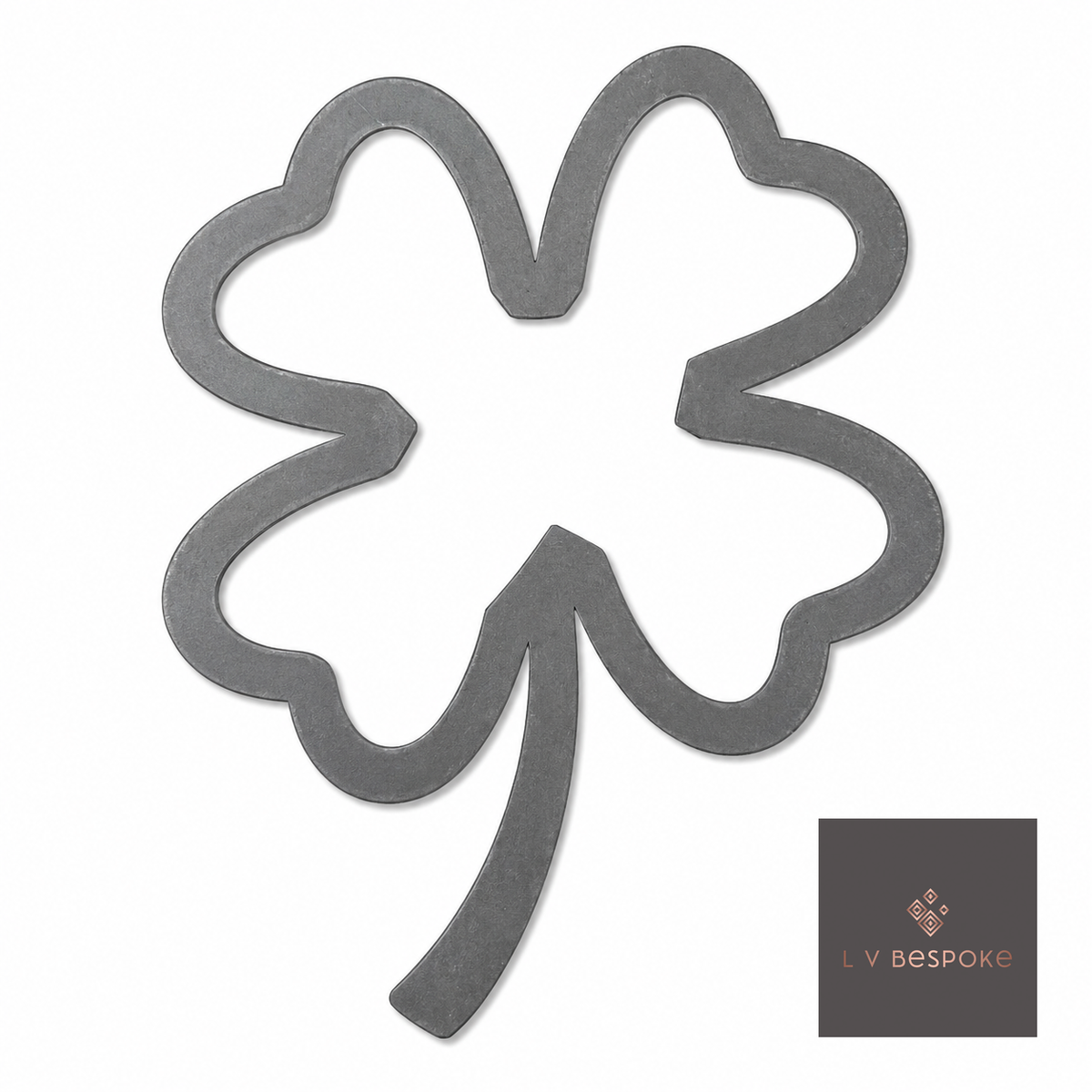 Raw steel Four-Leaf Clover flower head on a garden stake, planted in a border