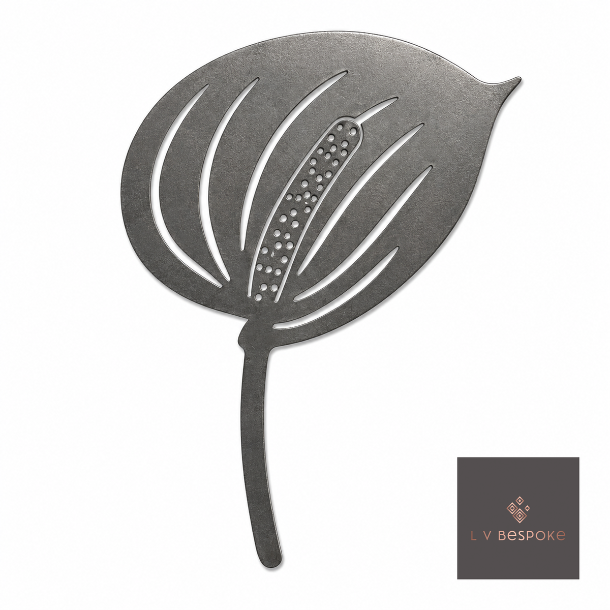 Raw steel Anthurium flower head on a garden stake, planted in a border