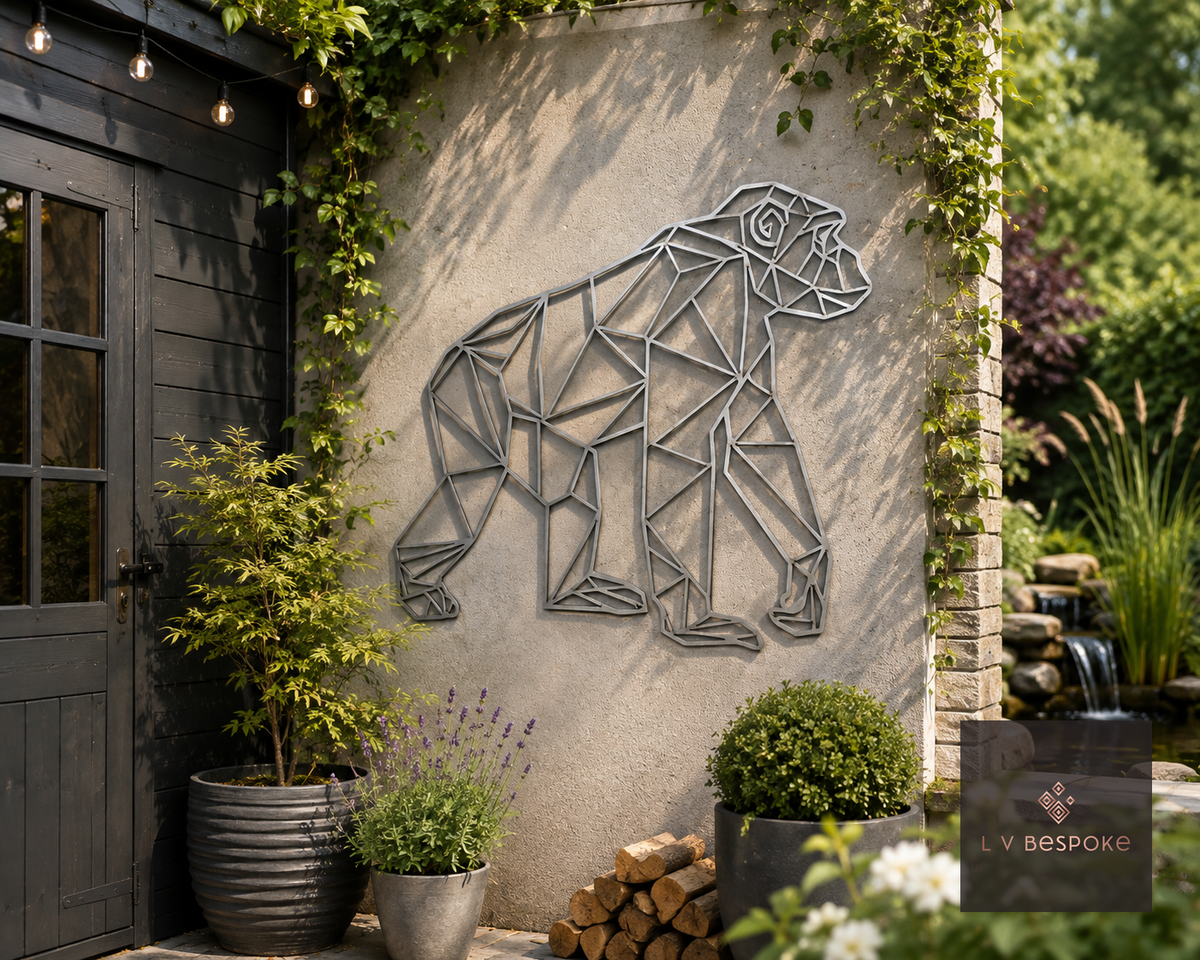 Raw steel geometric Gorilla wall art hung on a garden wall