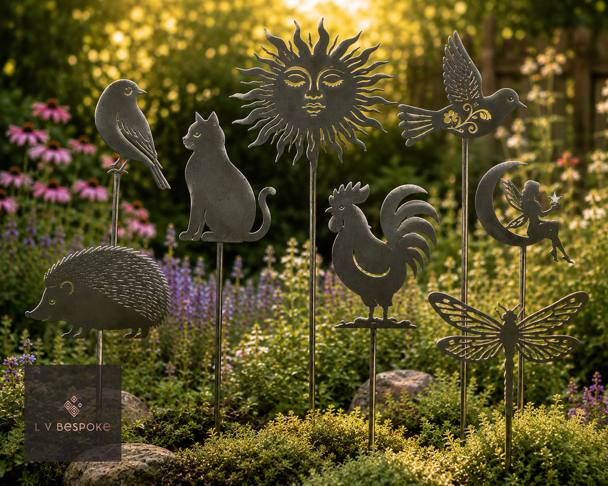 Decorative Plant Stakes in a range of designs, staked together in a border at golden hour