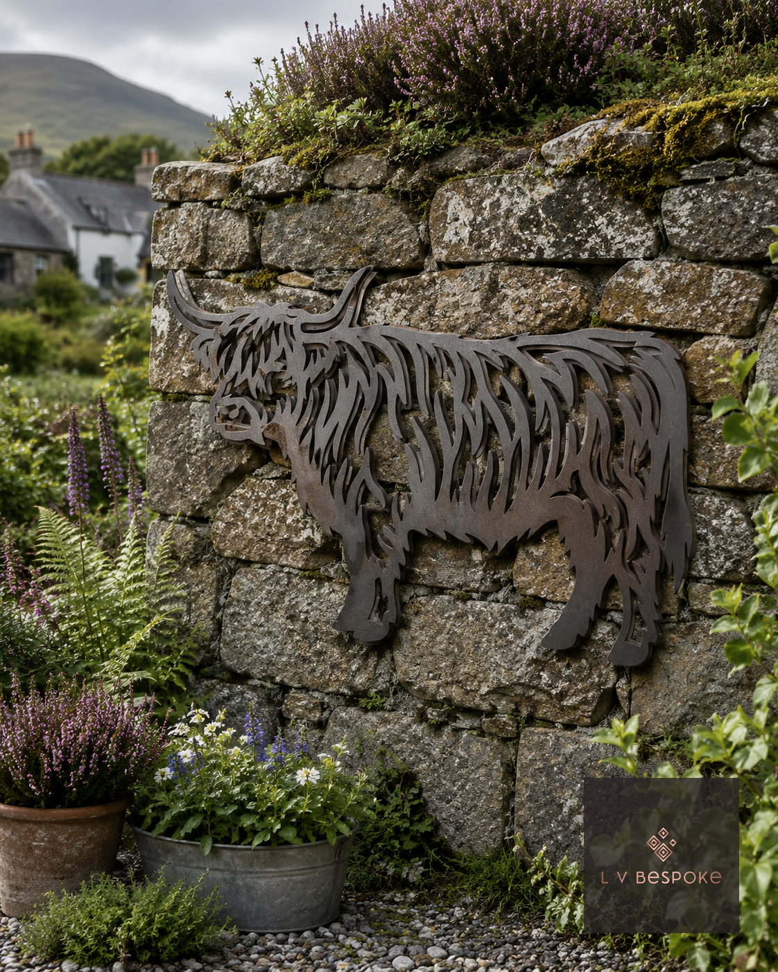 Raw steel Highland Cow wall art on a garden wall