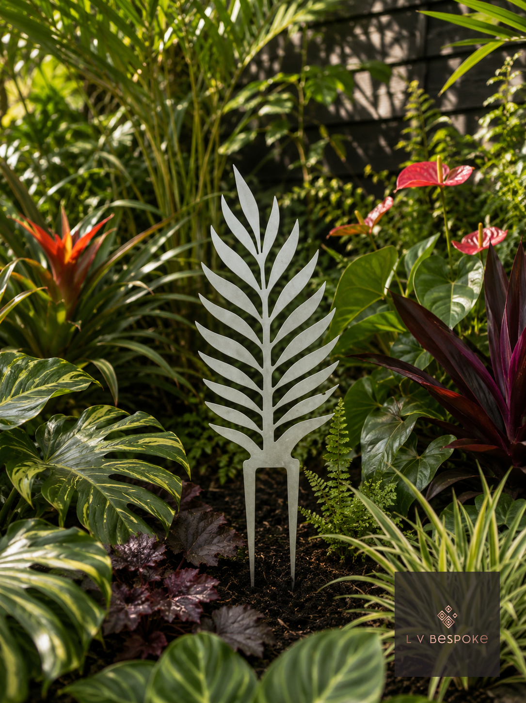 Raw steel Palm Leaf Garden Stake in a garden border or on a wall
