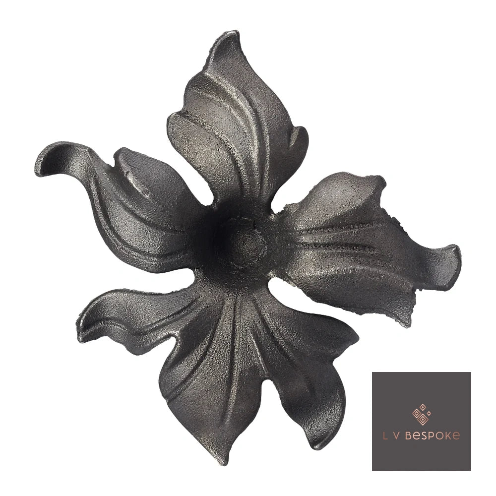 Raw steel Lily flower head on a garden stake, planted in a border