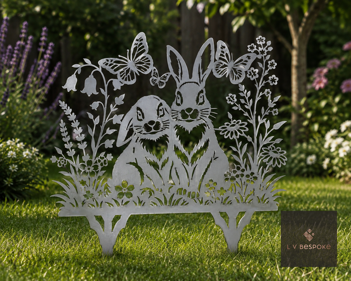 Raw steel Rabbits & Butterflies Garden Stake standing in a border
