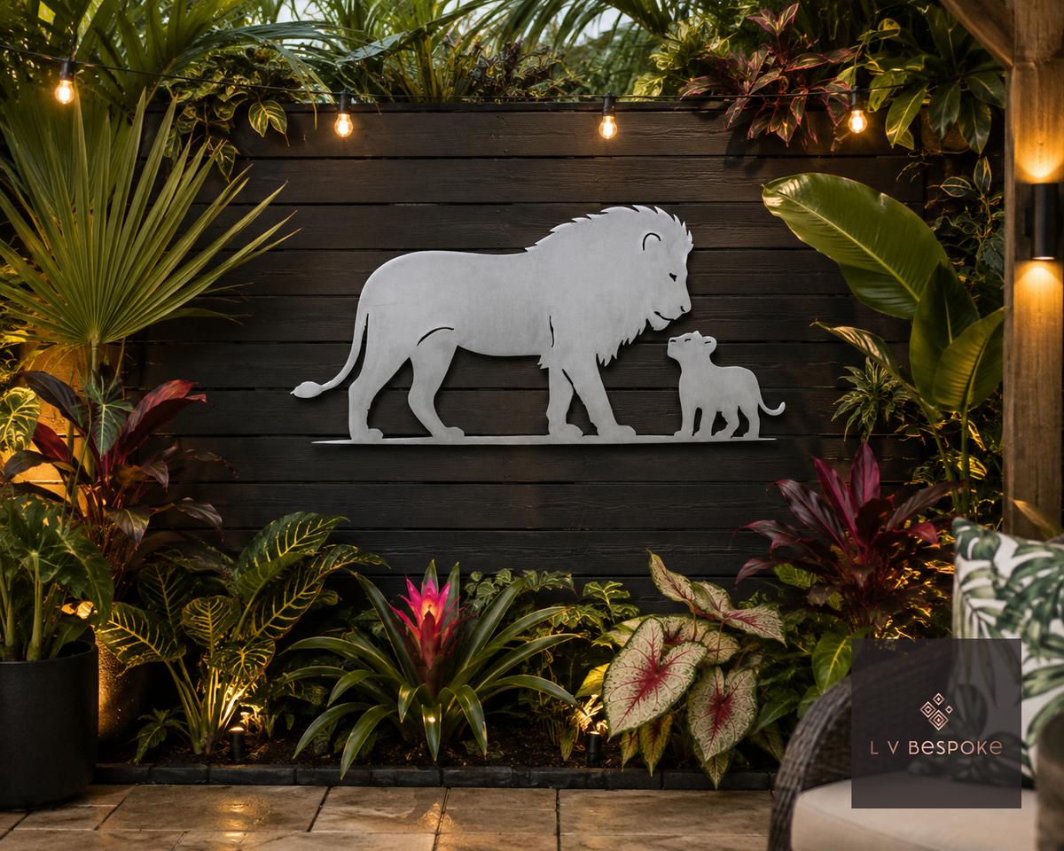 Raw steel Lion & Cub wall art hung on a garden wall