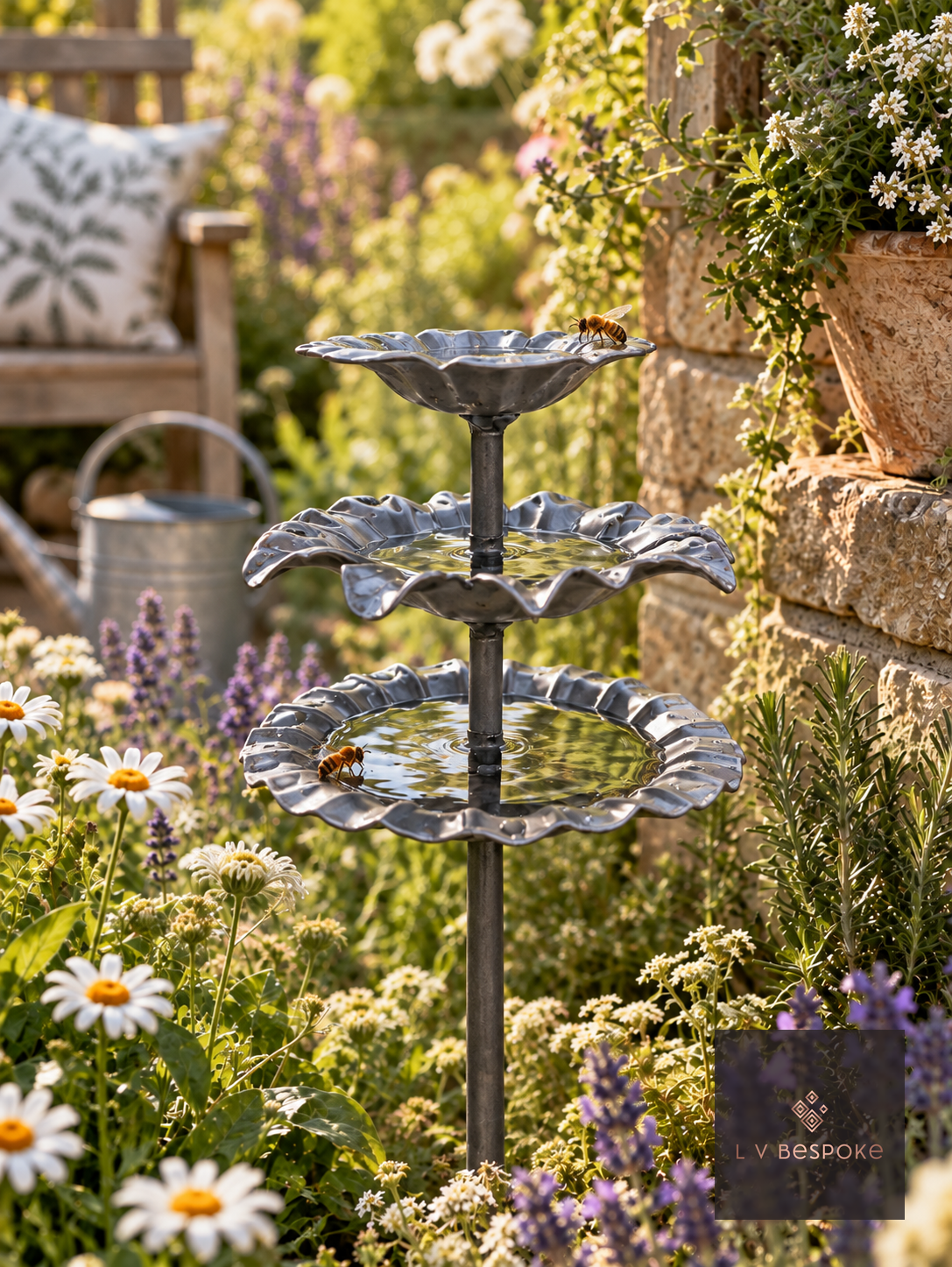 Triple tier steel bee drinker with petal shaped floral dishes and bees drinking